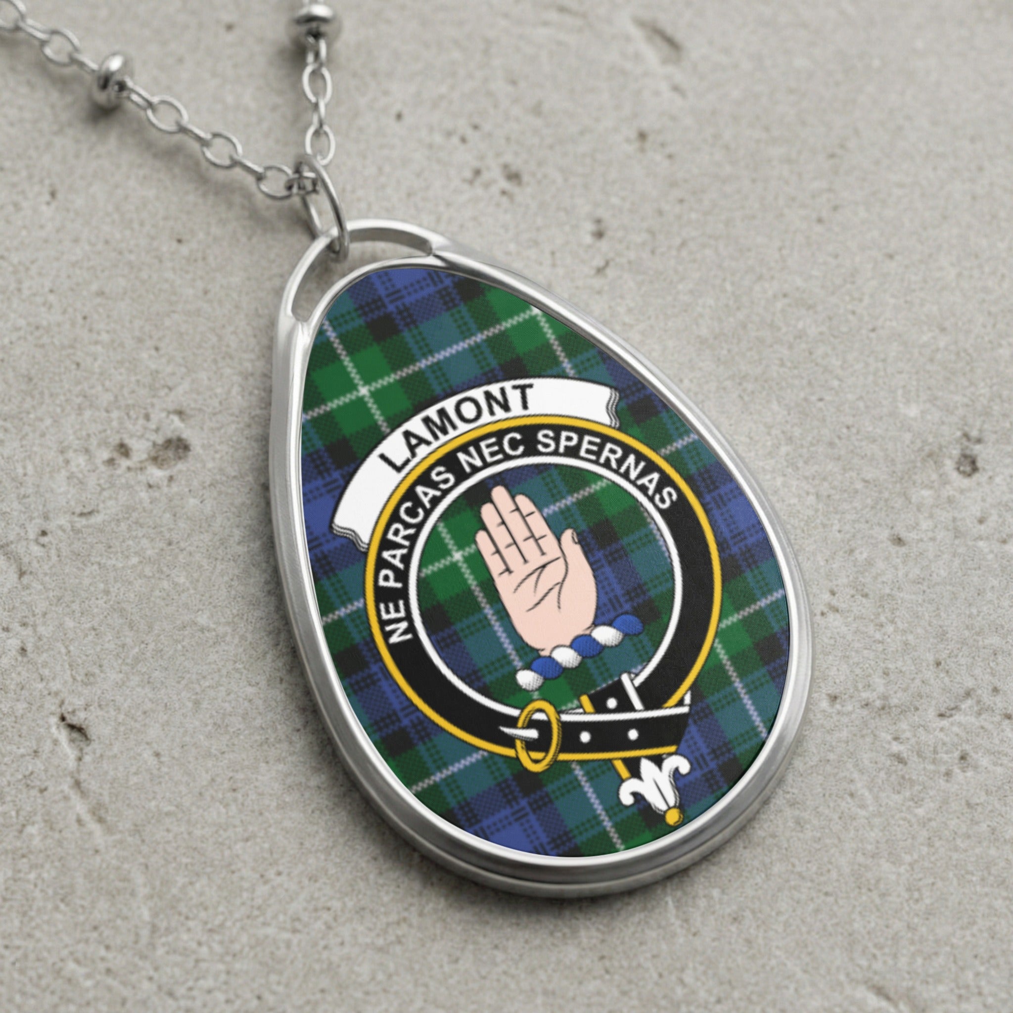 Lamont clan Scottish tartan necklace with clan crest and Ne Parcas Nec Spernas motto on tartan background