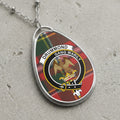 Drummond clan Scottish tartan necklace with clan crest on tartan background