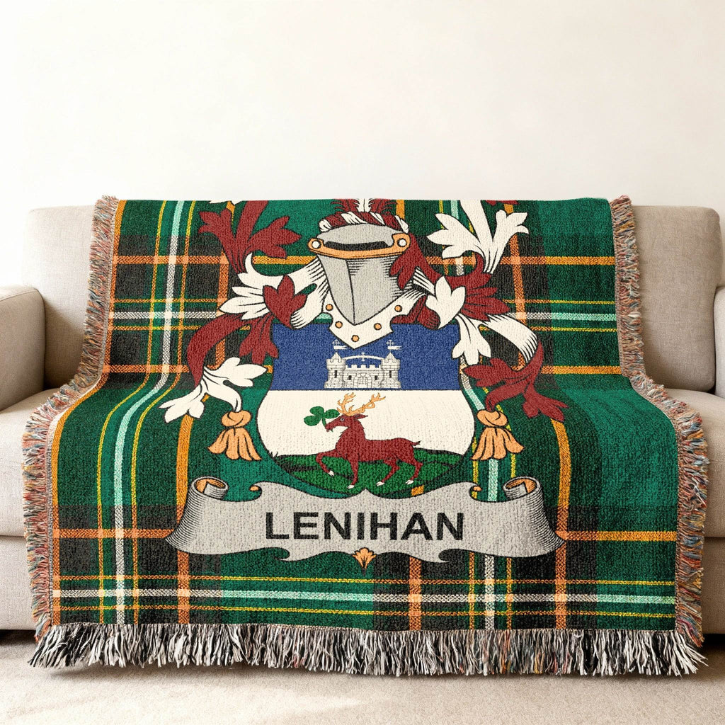 Green tartan throw blanket featuring the Lenihan family crest on a couch.