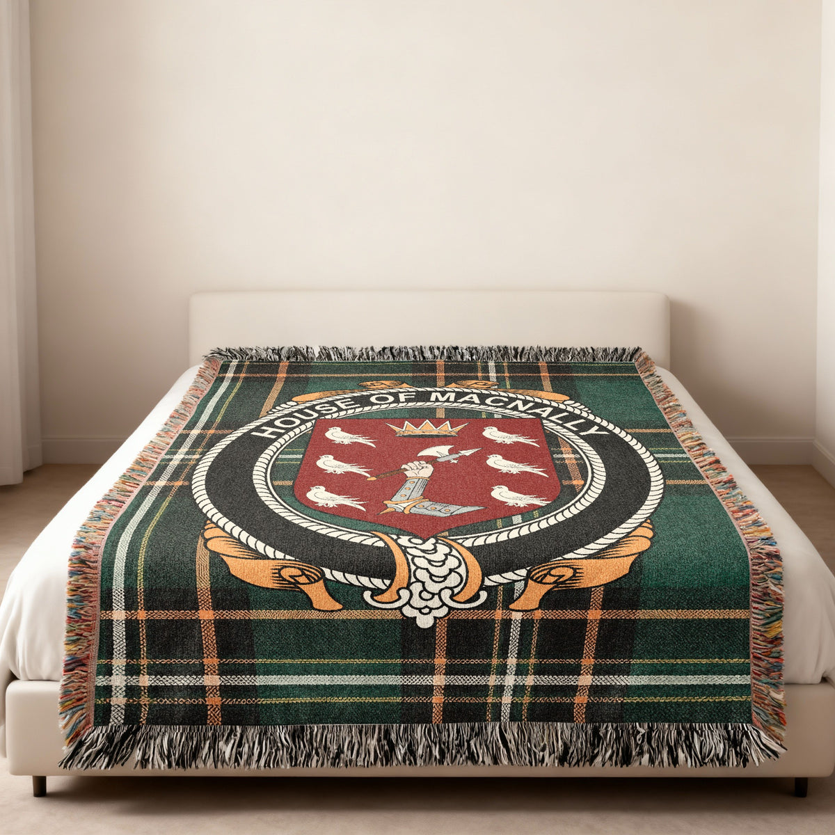 MacNally family crest emblem woven blanket displayed on a bed