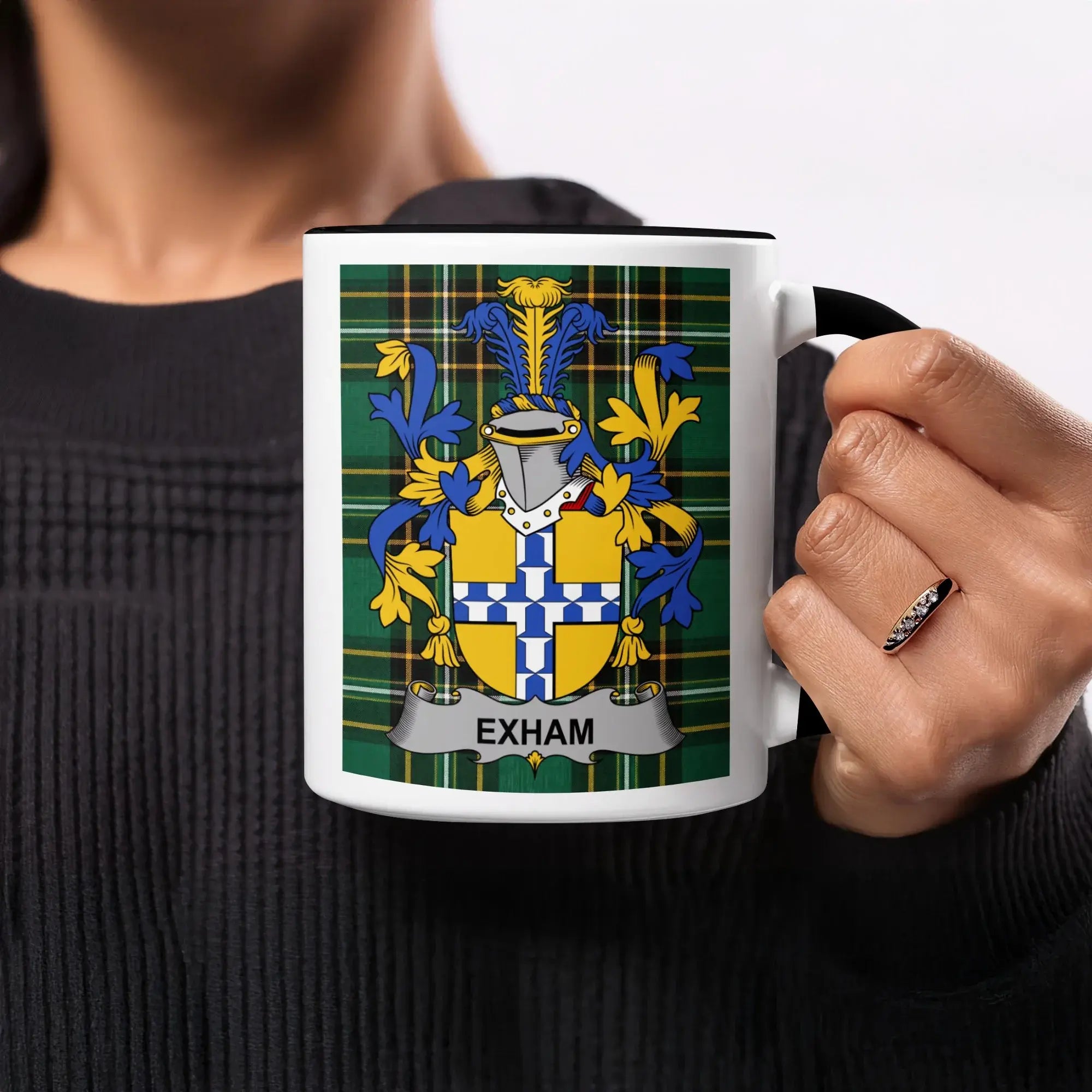 Mug with Exham family crest on plaid background.