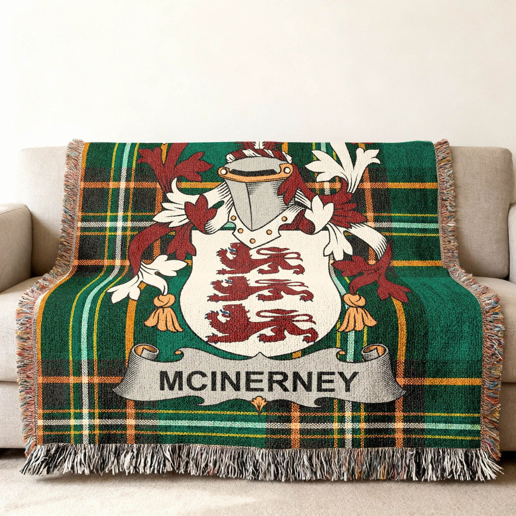 McInerney family crest on green plaid throw blanket with fringe.