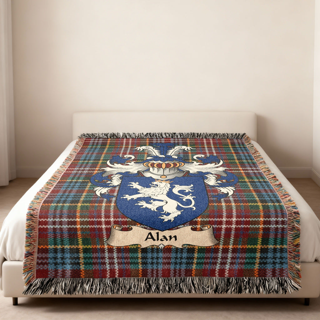 Alan family crest emblem on a Caledonia tartan woven blanket