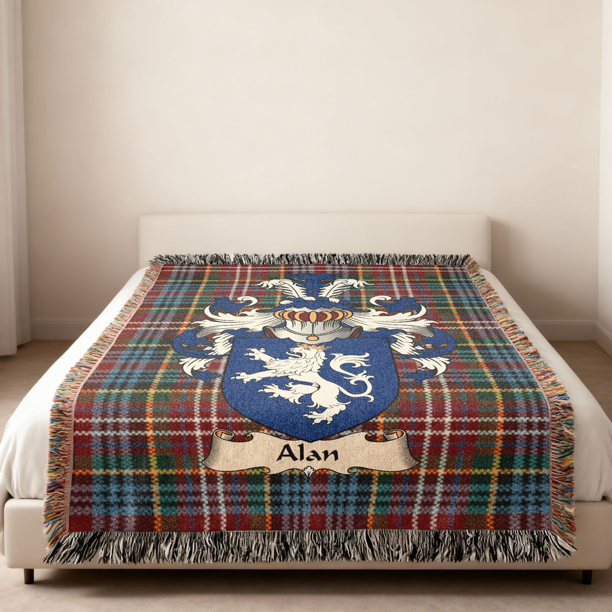 Alan family crest emblem on a Caledonia tartan woven blanket
