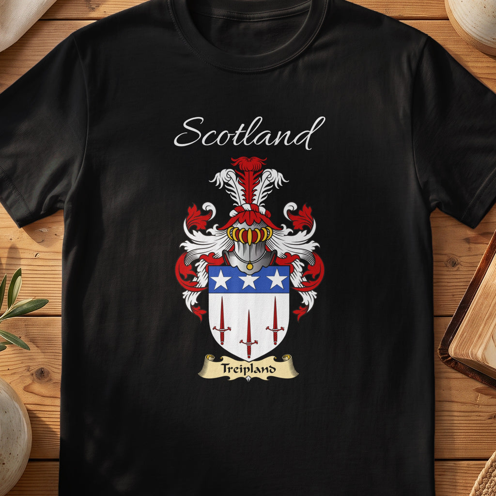 Black Treipland Scottish family crest T-shirt laid flat, showing “Scotland” above a red-blue-and-silver shield with stars and slender vertical devices.
