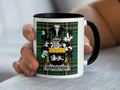 White mug with black handle featuring a green tartan crest with the name MARGETSON.