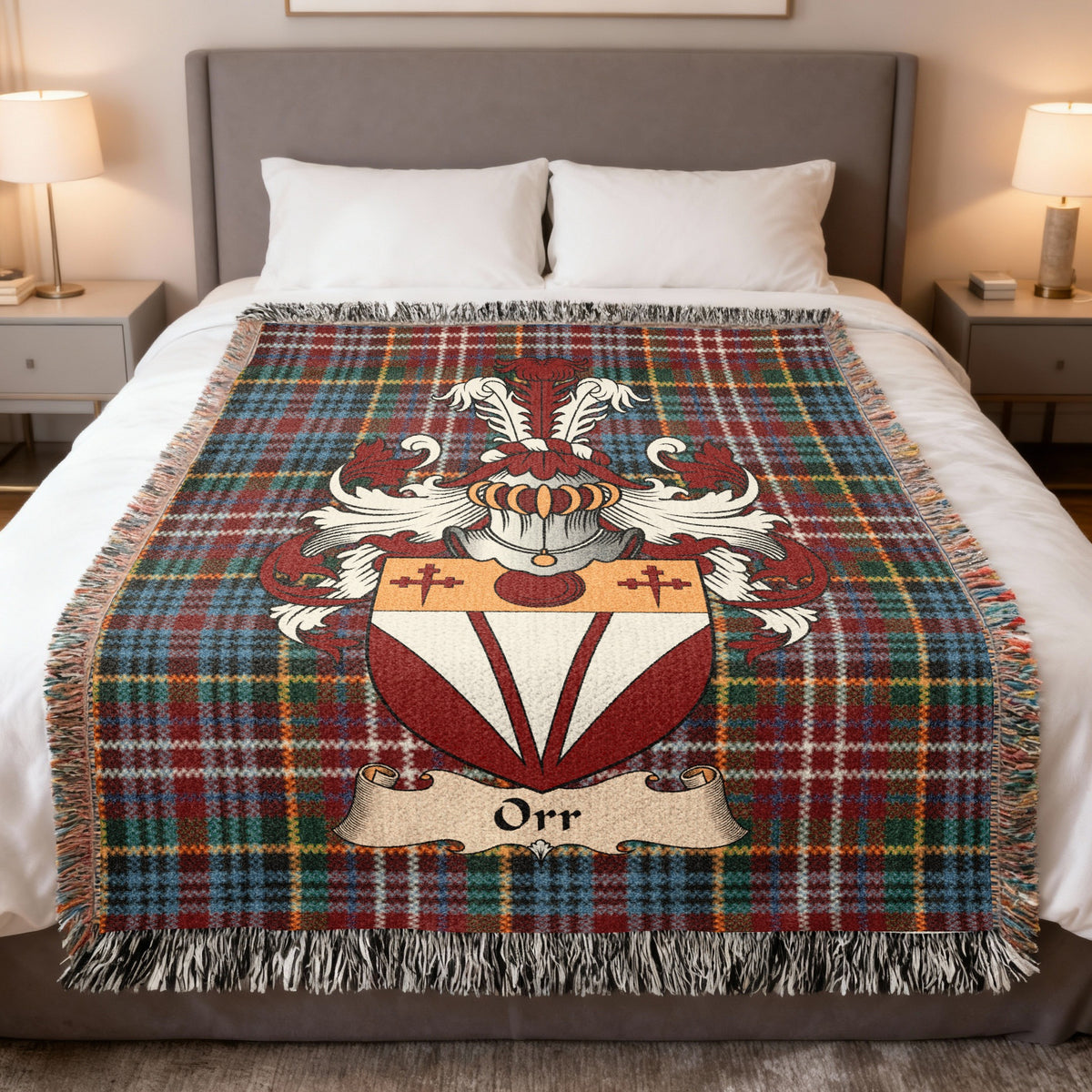 Orr family crest emblem on a Caledonia tartan woven blanket