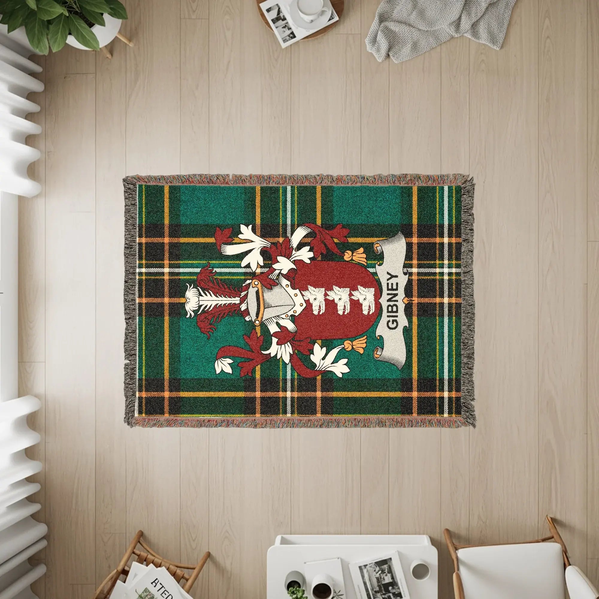 Green plaid woven blanket featuring the Gibney family crest.
