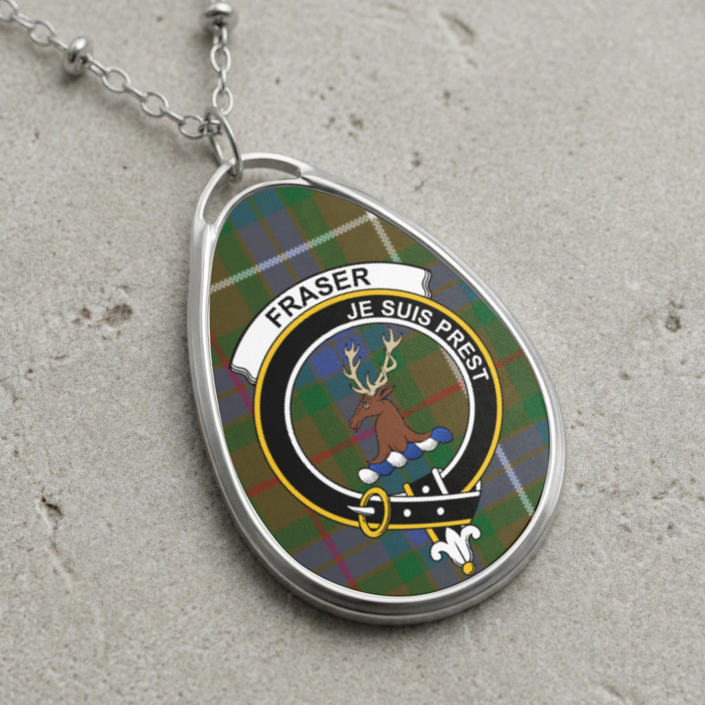 Fraser clan Scottish tartan necklace with clan crest and Je Suis Prest motto on tartan background