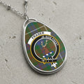Fraser clan Scottish tartan necklace with clan crest and Je Suis Prest motto on tartan background