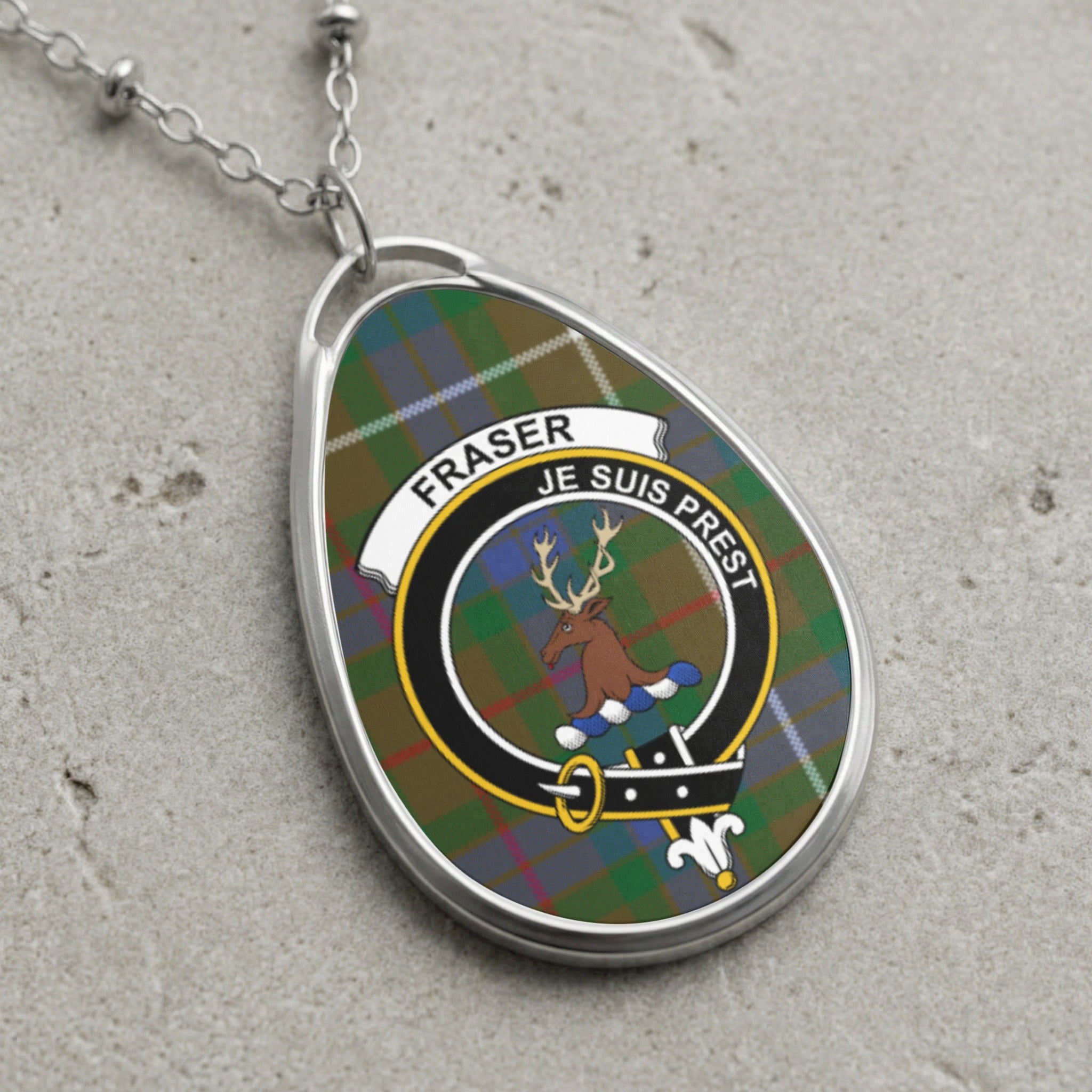 Fraser clan Scottish tartan necklace with clan crest and Je Suis Prest motto on tartan background