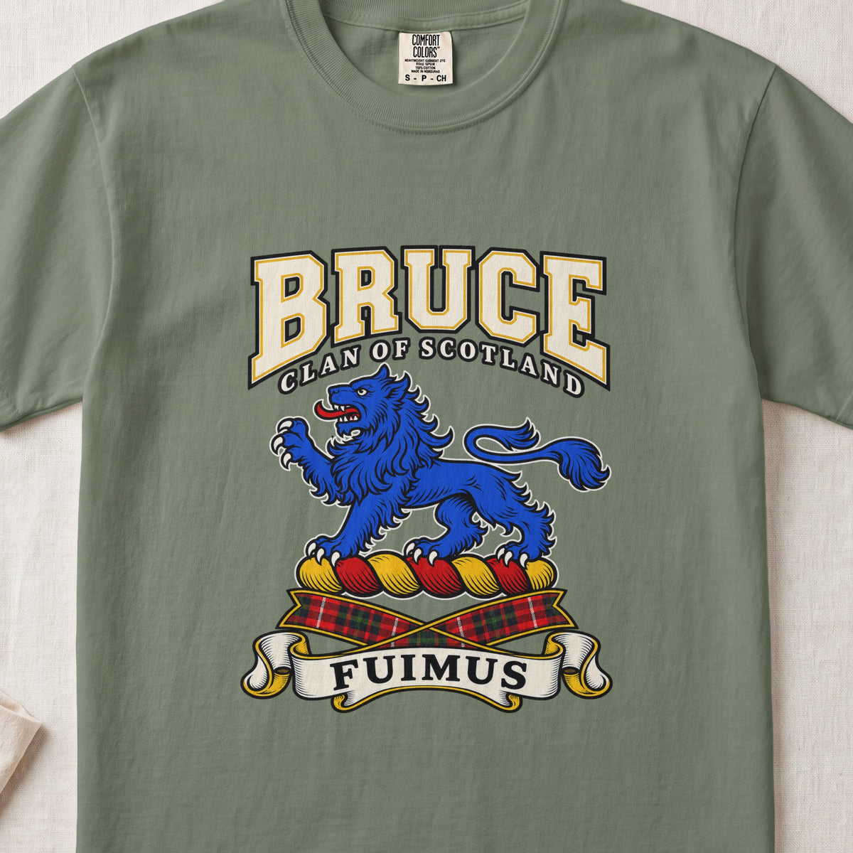 Moss Bruce Scottish clan T-shirt, front flat lay with varsity lettering, blue lion crest and Fuimus motto.