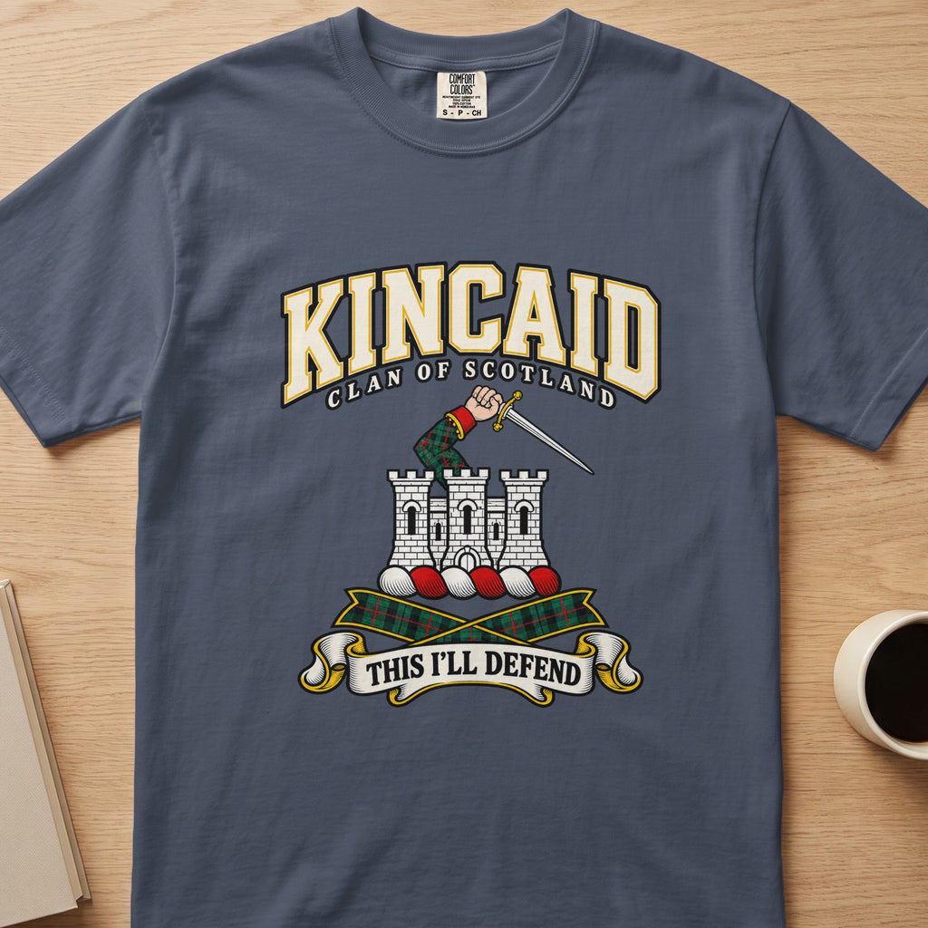 Kincaid castle and raised sword graphic on a slate blue Comfort Colors T-shirt, front view