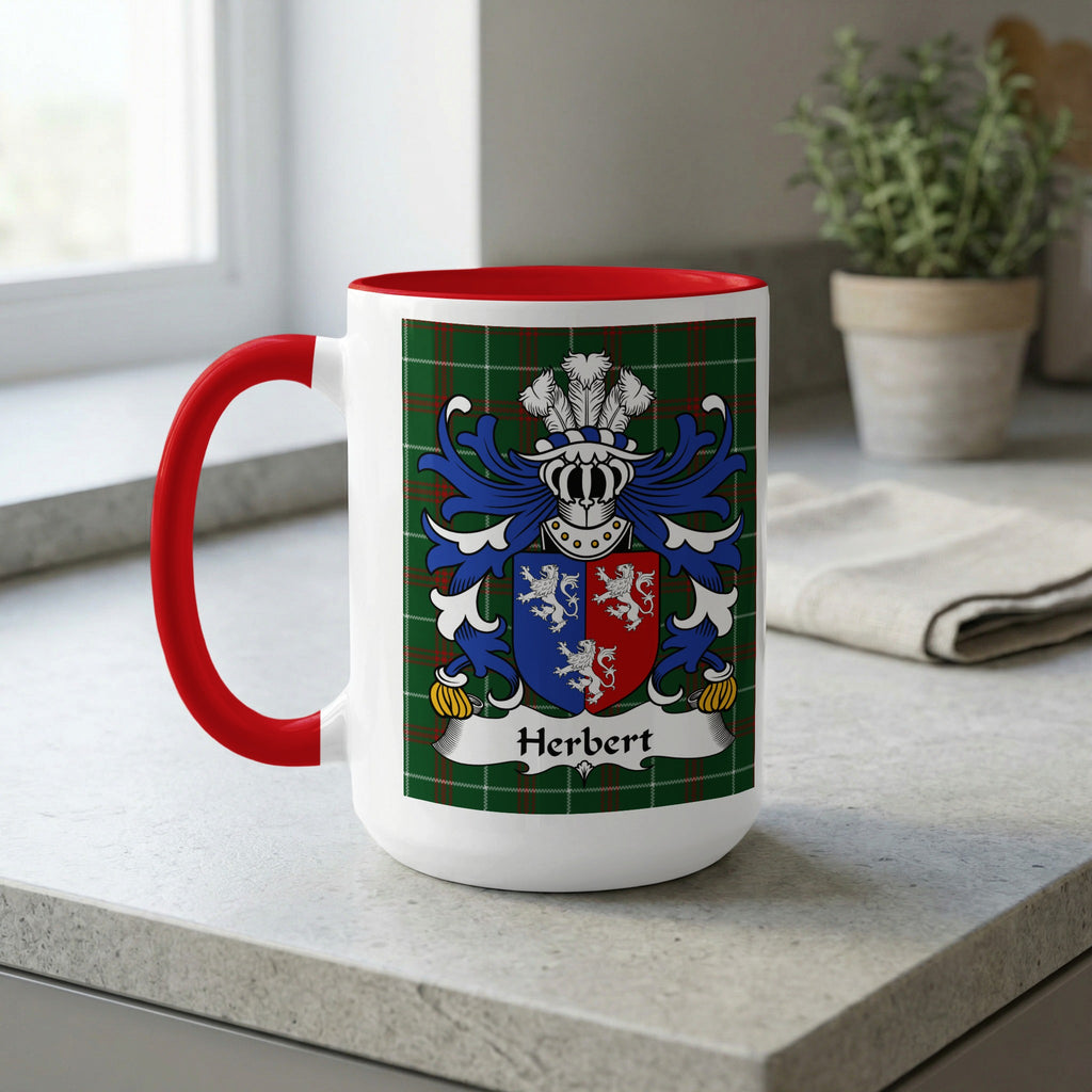 White mug with red handle features Herbert family crest on tartan background.