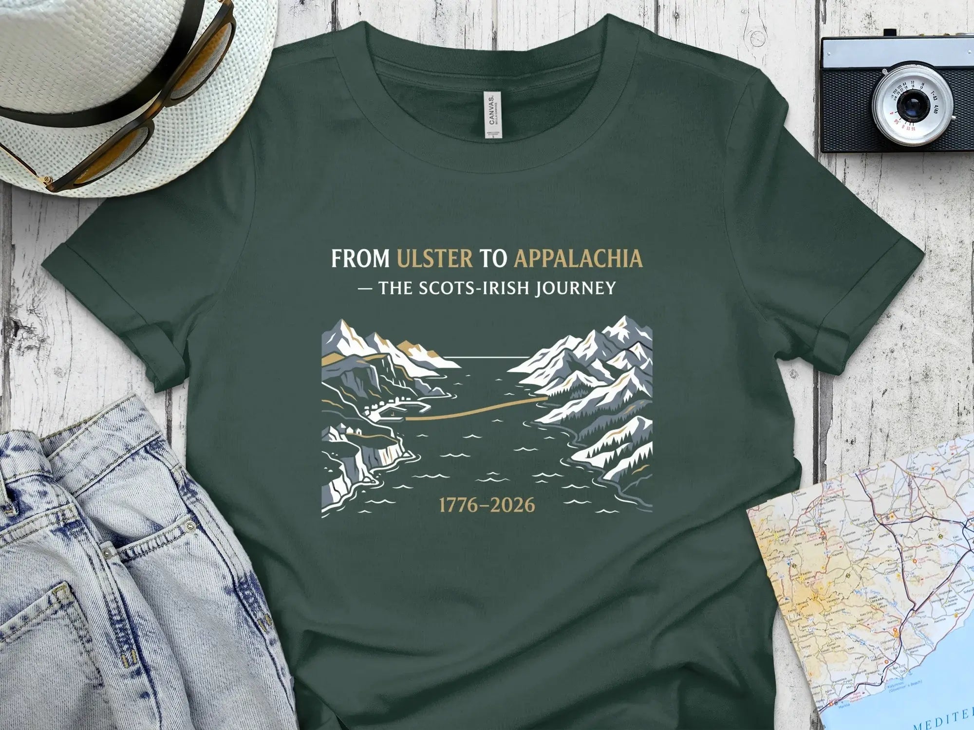 T-shirt with "From Ulster to Appalachia - The Scots-Irish Journey 1776-2026" graphic.