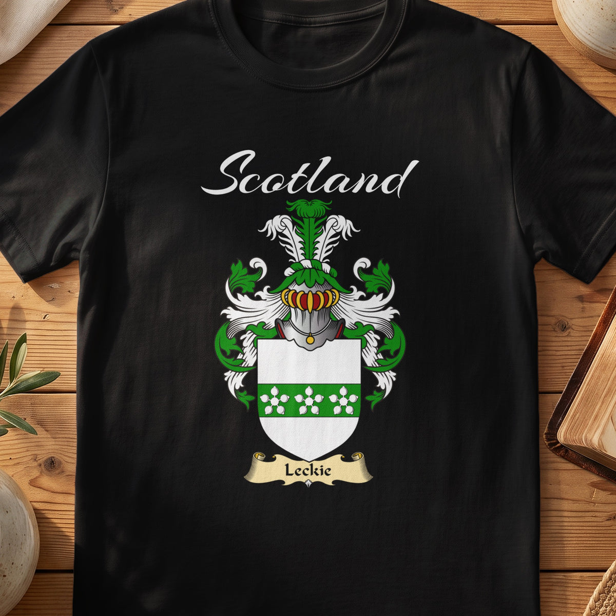 Black Leckie Scottish T-shirt featuring a green patterned band across a white shield
