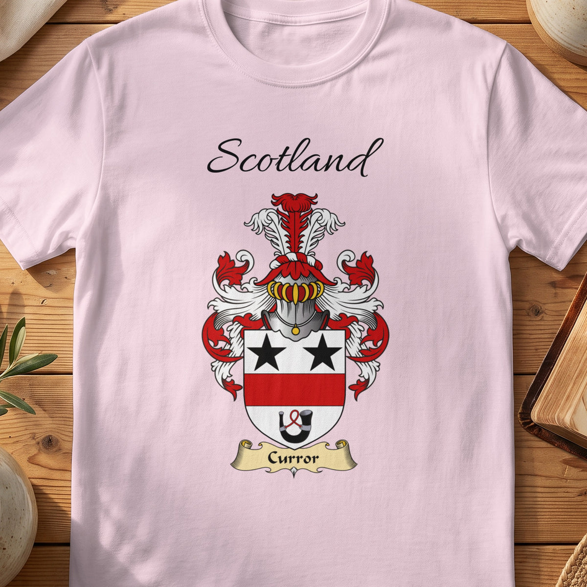 Light Pink Curror Scottish family shield T-shirt featuring black stars above a red horizontal band