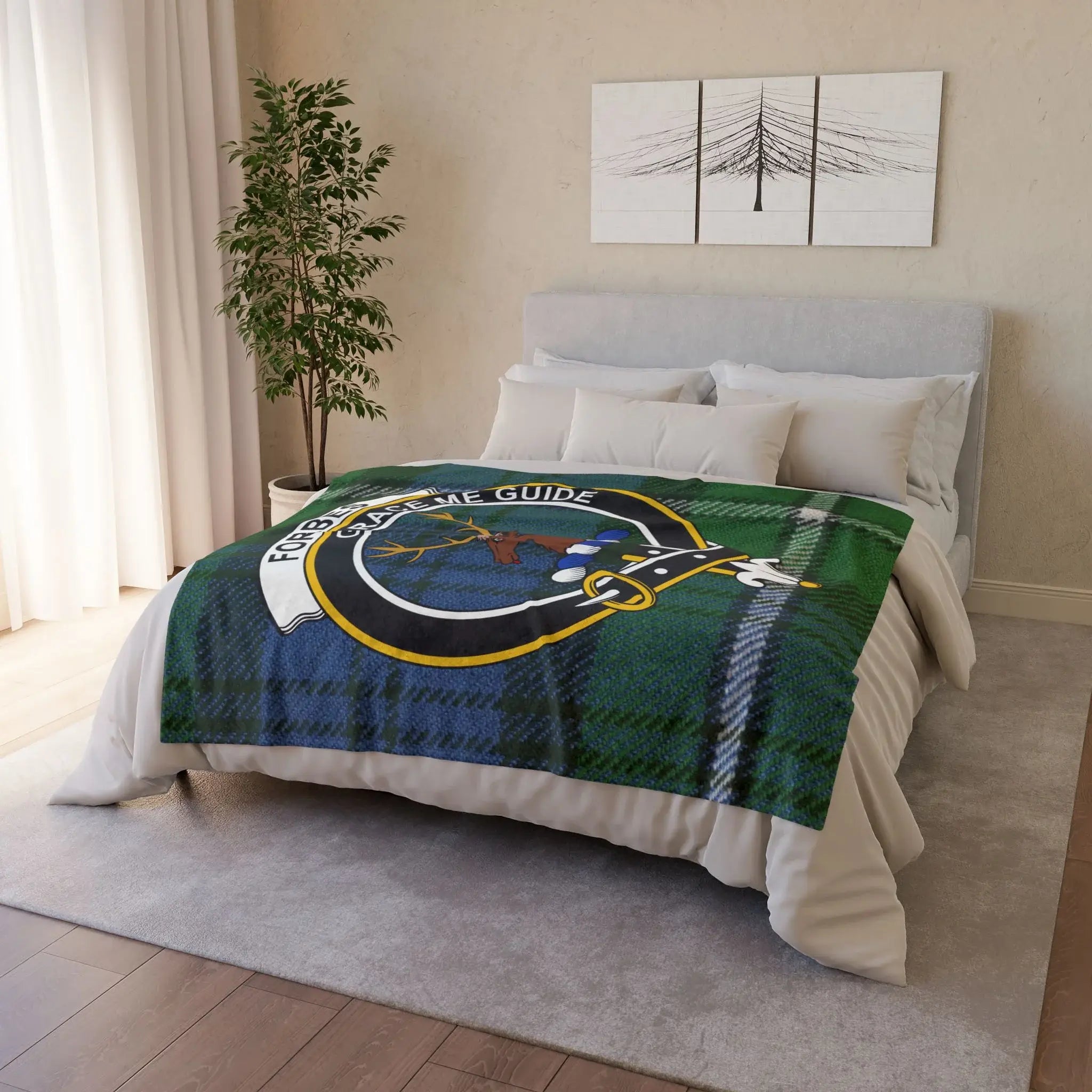 Forbes clan tartan throw blanket draped on bed — plaid with stag crest, 50x60 polyester