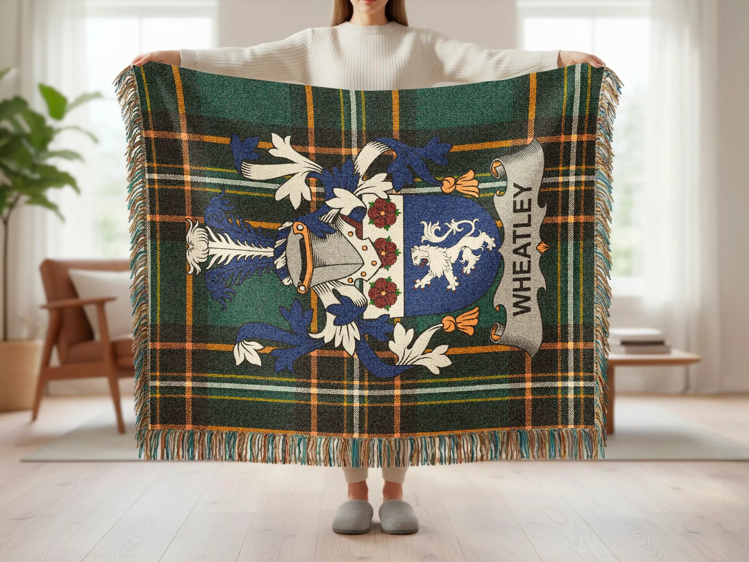 Tartan throw with Wheatley crest, featuring lions and heraldry.