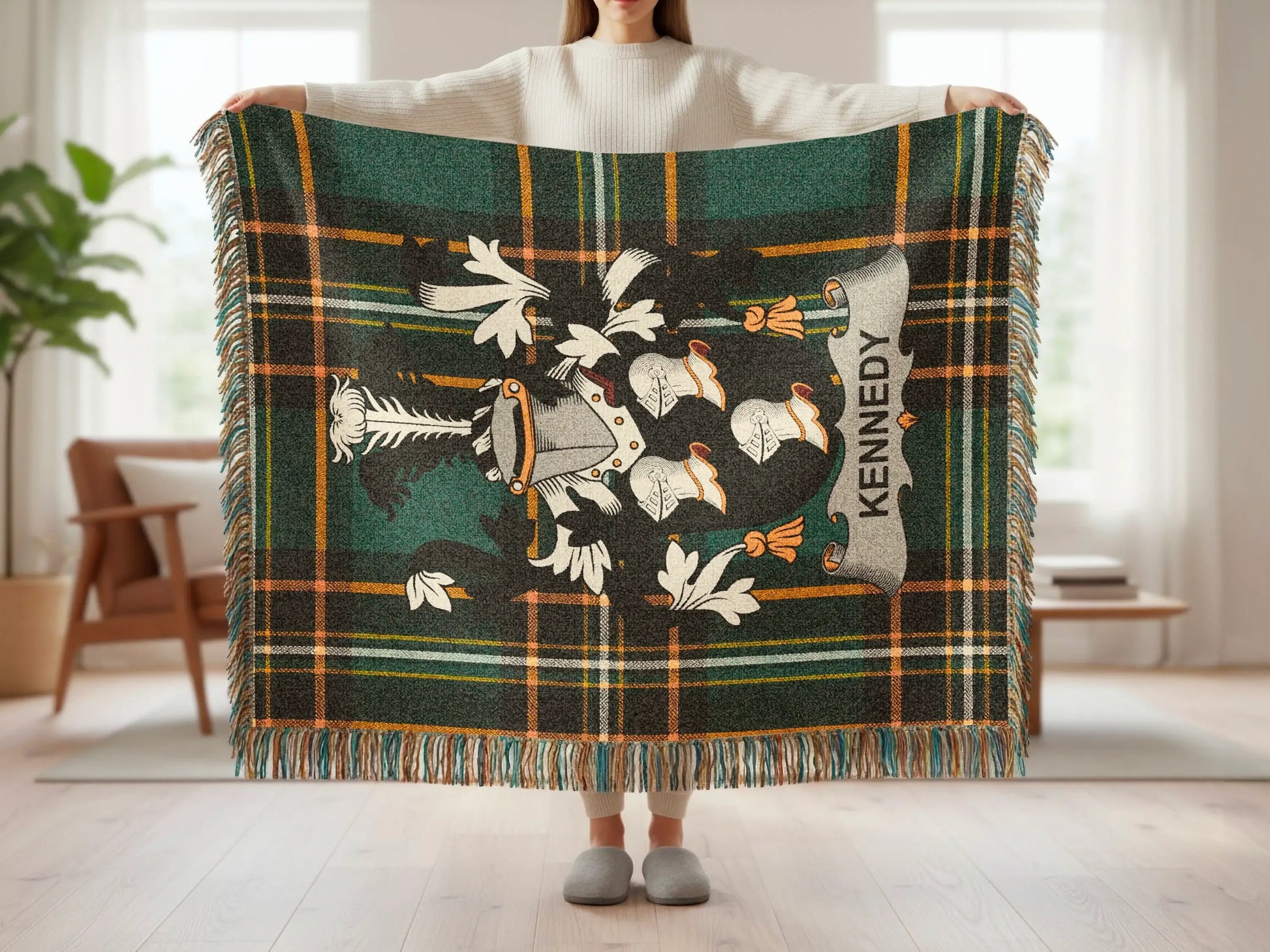 Green and black plaid blanket with a crest and "Kennedy" text.