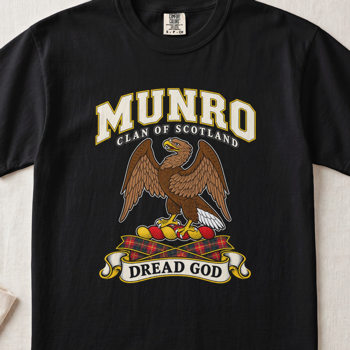 Munro Scottish clan T-shirt in Black, front view with a brown eagle with spread wings and motto banner.