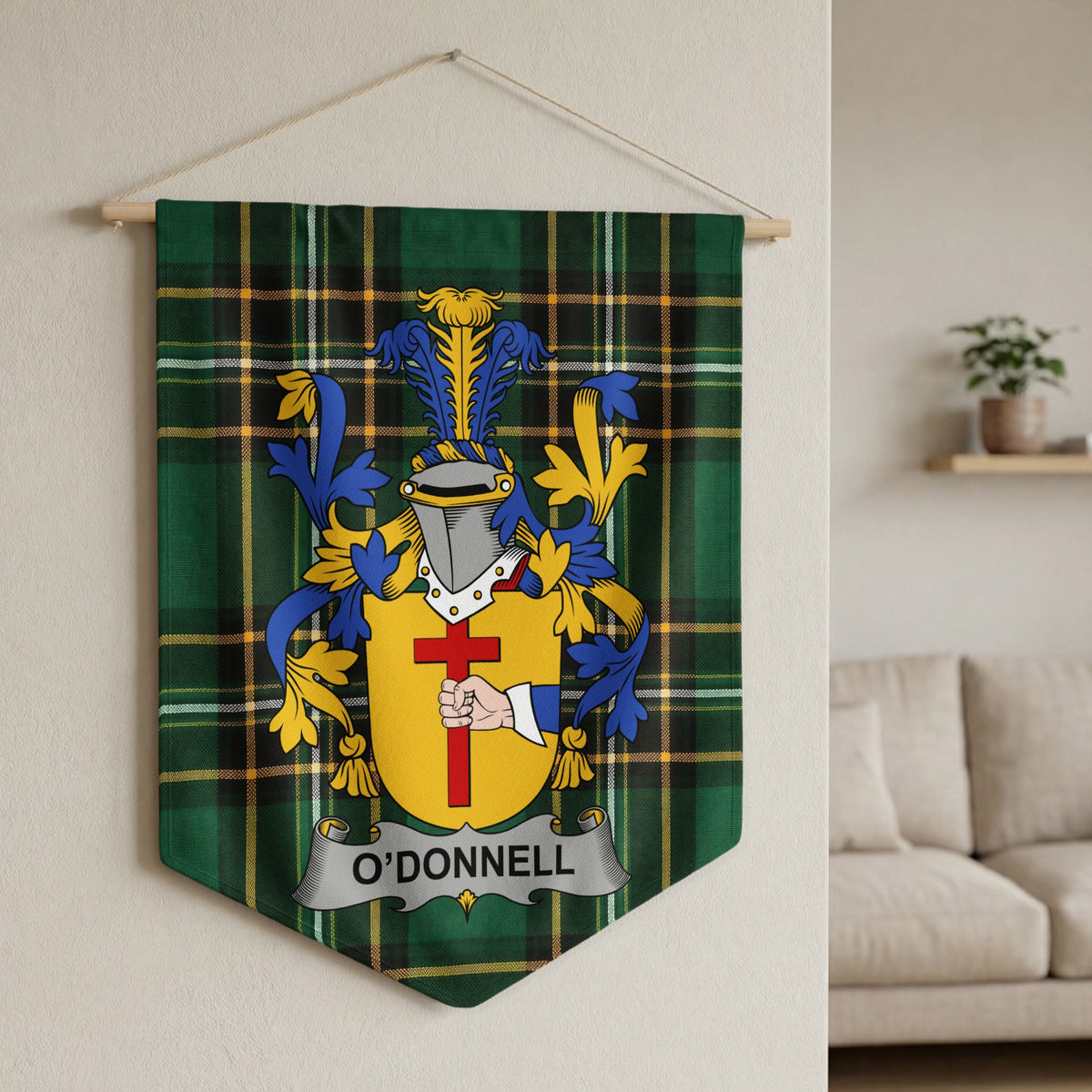 O'Donnell family crest banner on green plaid, featuring a helmet and hand holding a cross.