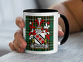 Mug with black handle and rim, featuring Wingfield coat of arms on tartan background.