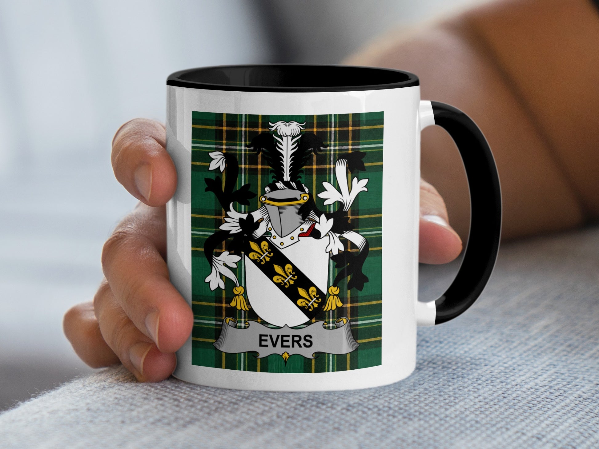 White mug with black rim displaying a coat of arms with the name "EVERS".