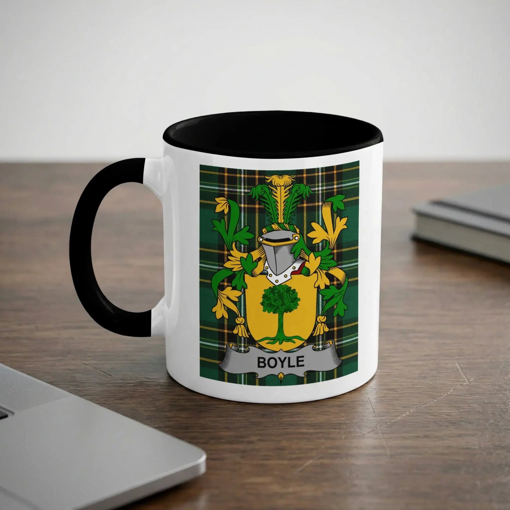 White mug with black handle featuring the Boyle family crest.