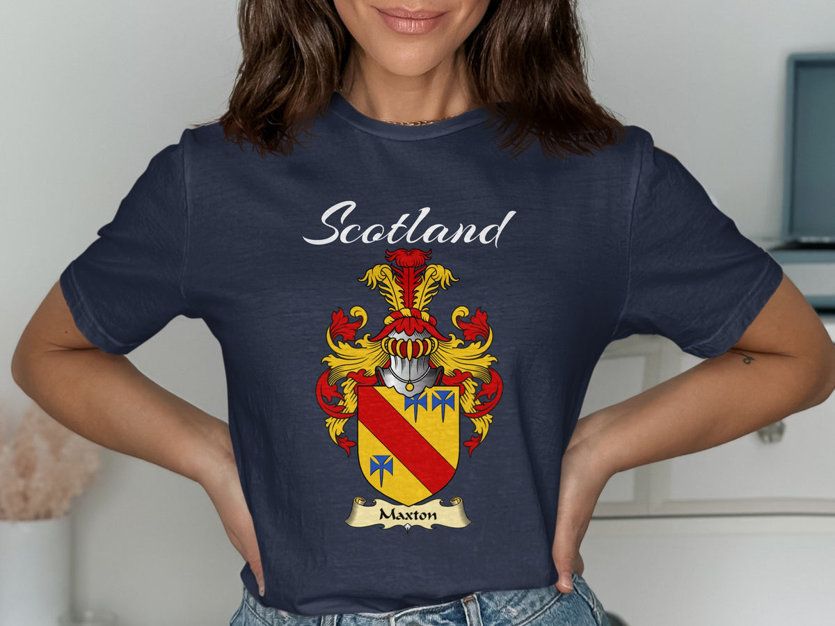 Model wearing a navy Maxton T-shirt featuring a red diagonal band and blue motifs on gold