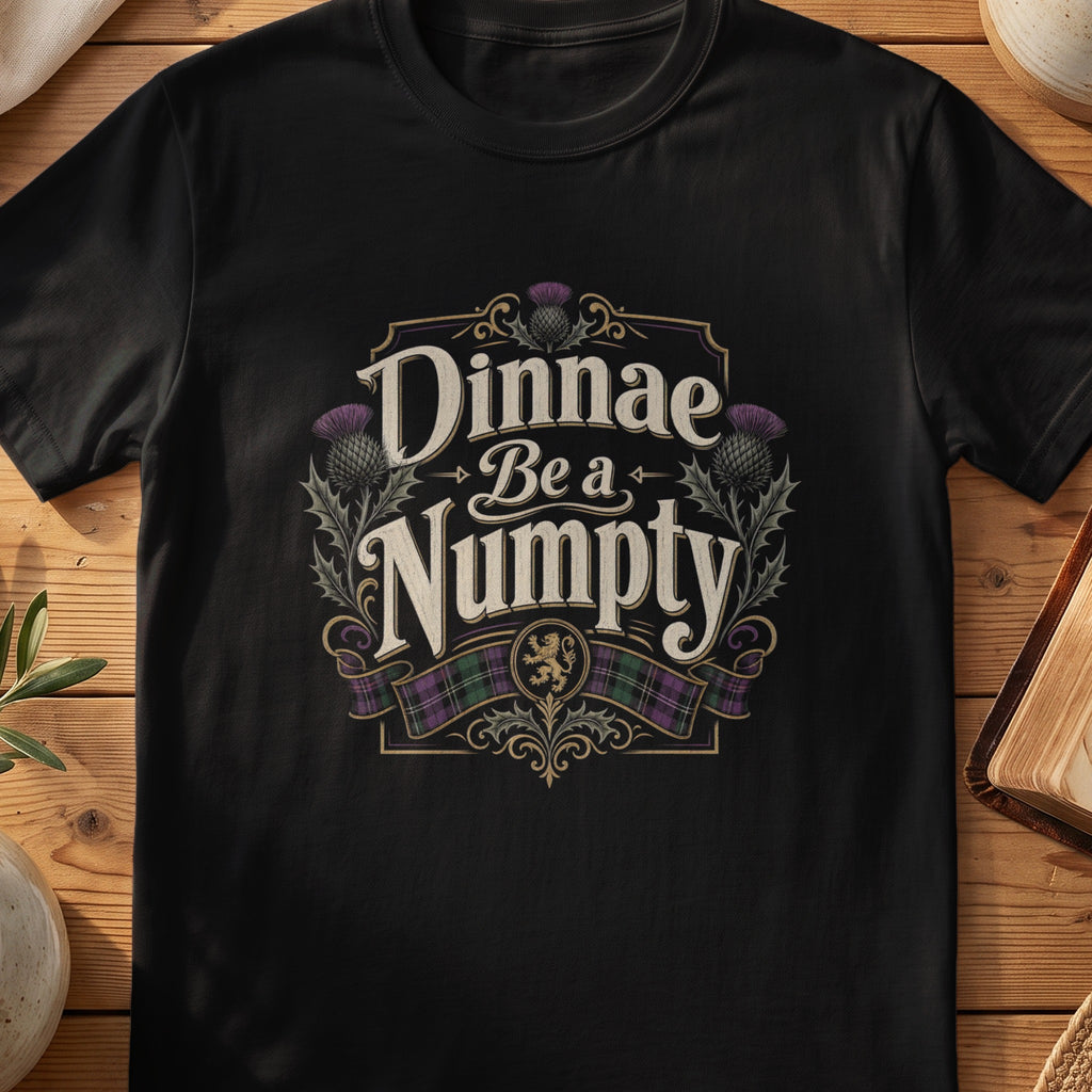 Black Gildan 64000 unisex T-shirt flatlay with Dinnae Be a Numpty Scottish graphic design