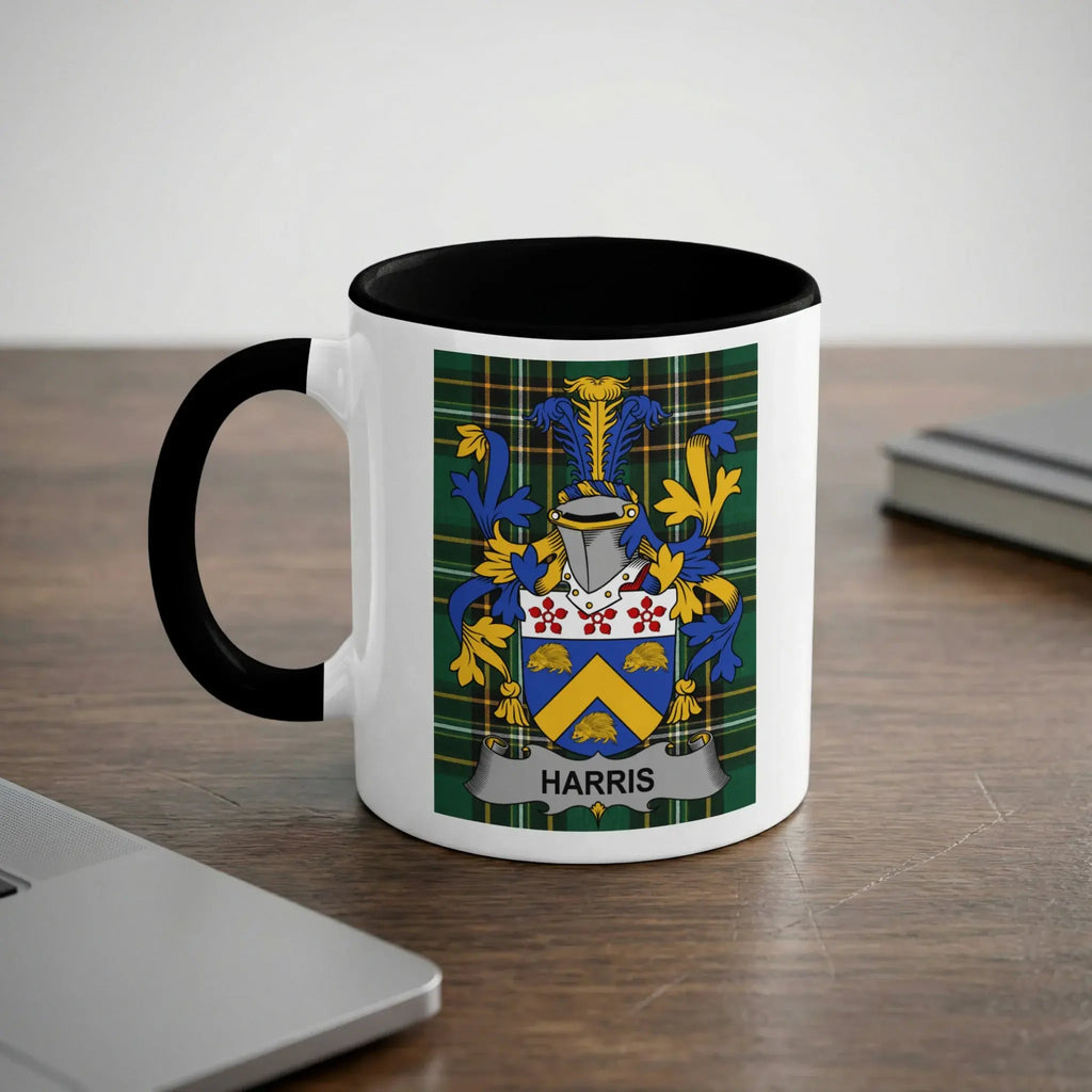 White mug with black rim and handle, displaying the Harris family crest.