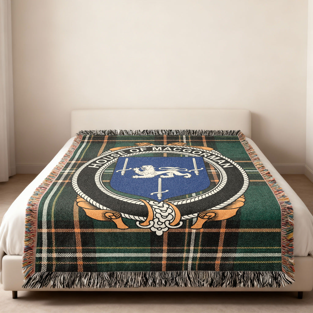 MacGorman family crest emblem woven blanket displayed on a bed