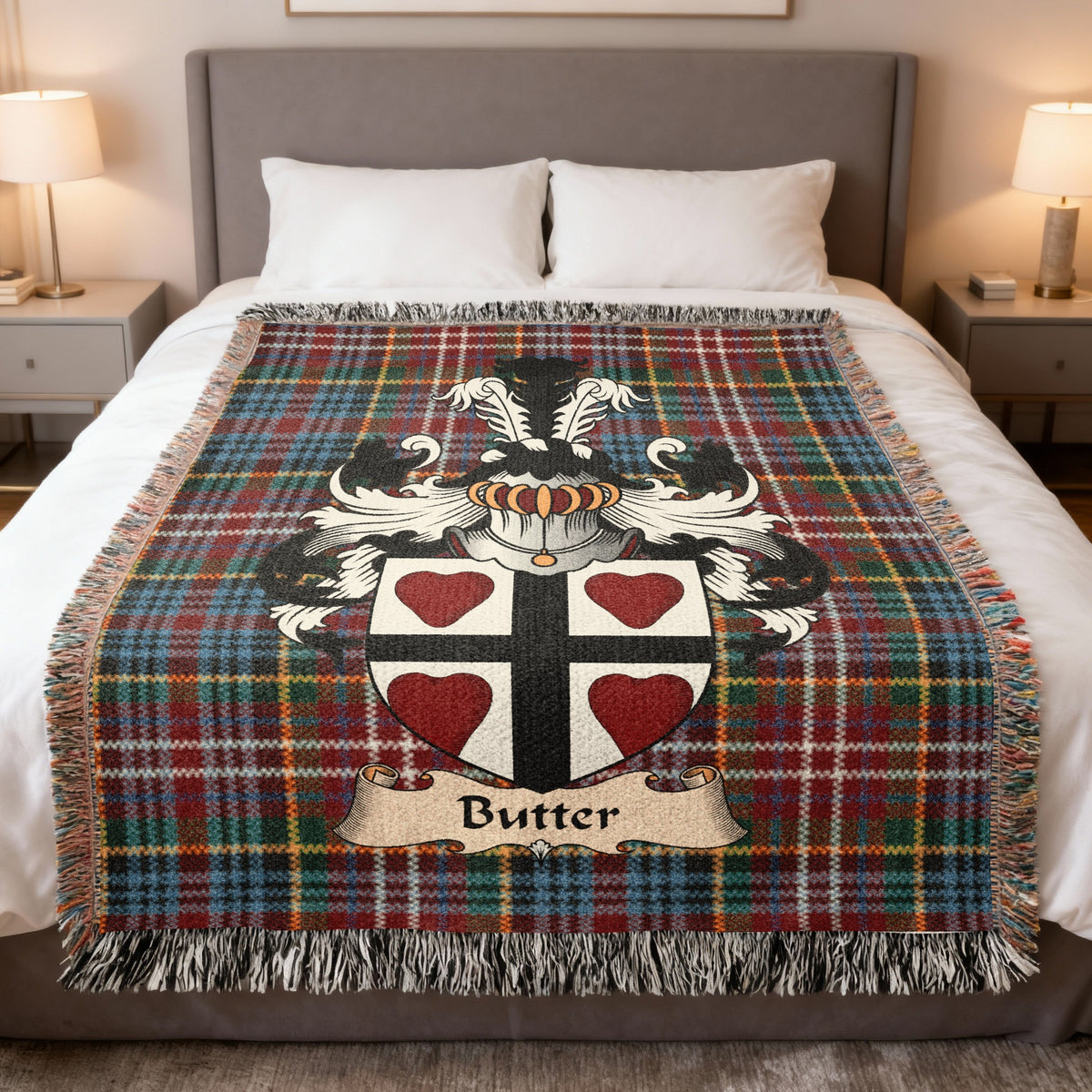 Butter family crest emblem on a Caledonia tartan woven blanket