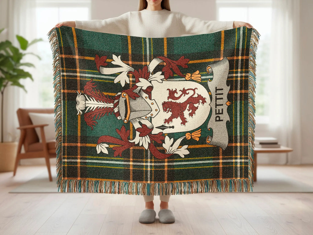 Plaid throw blanket with crest and Pettit surname.
