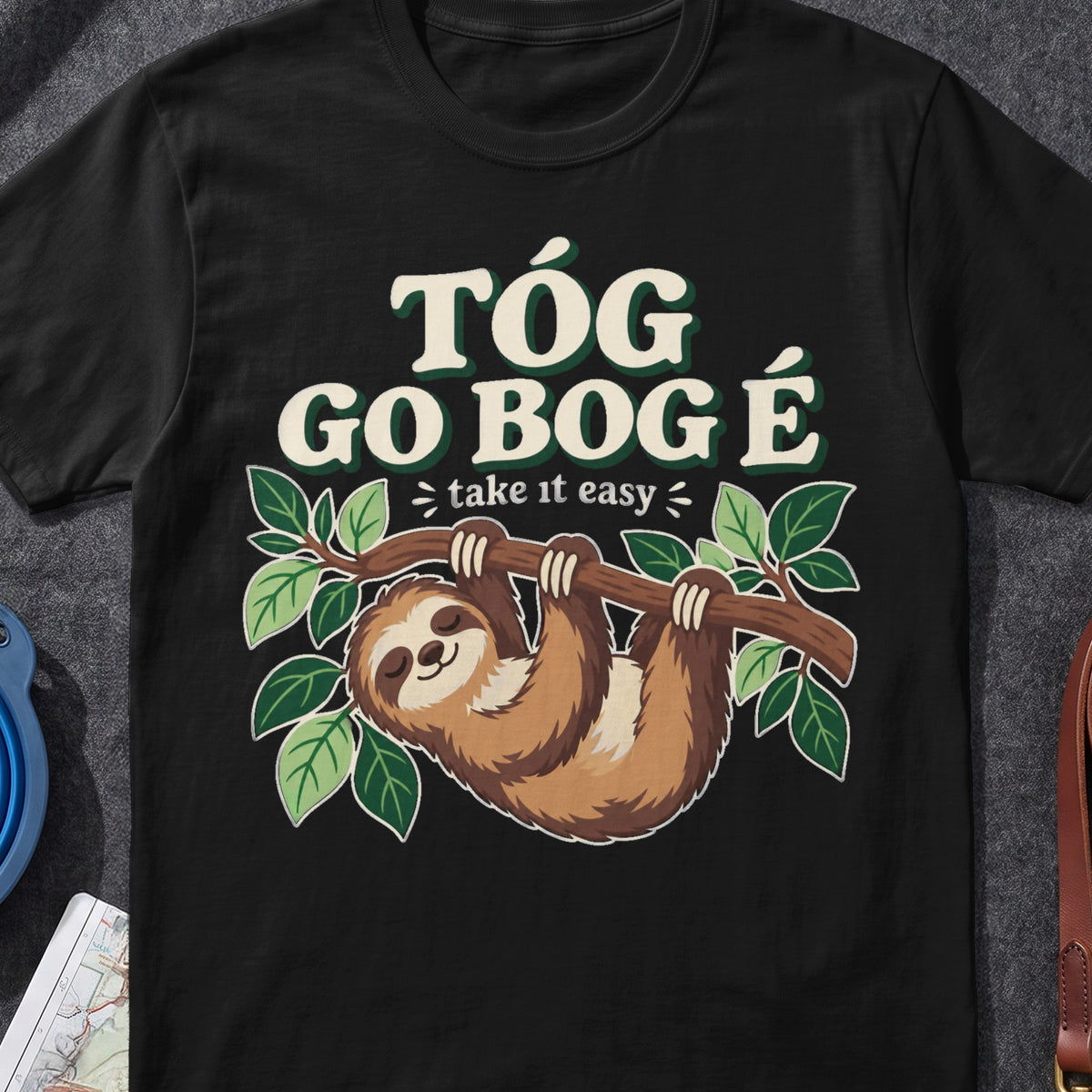 Tóg Go Bog É Take It Easy Sloth Irish graphic T-shirt in Black, flat-lay mockup