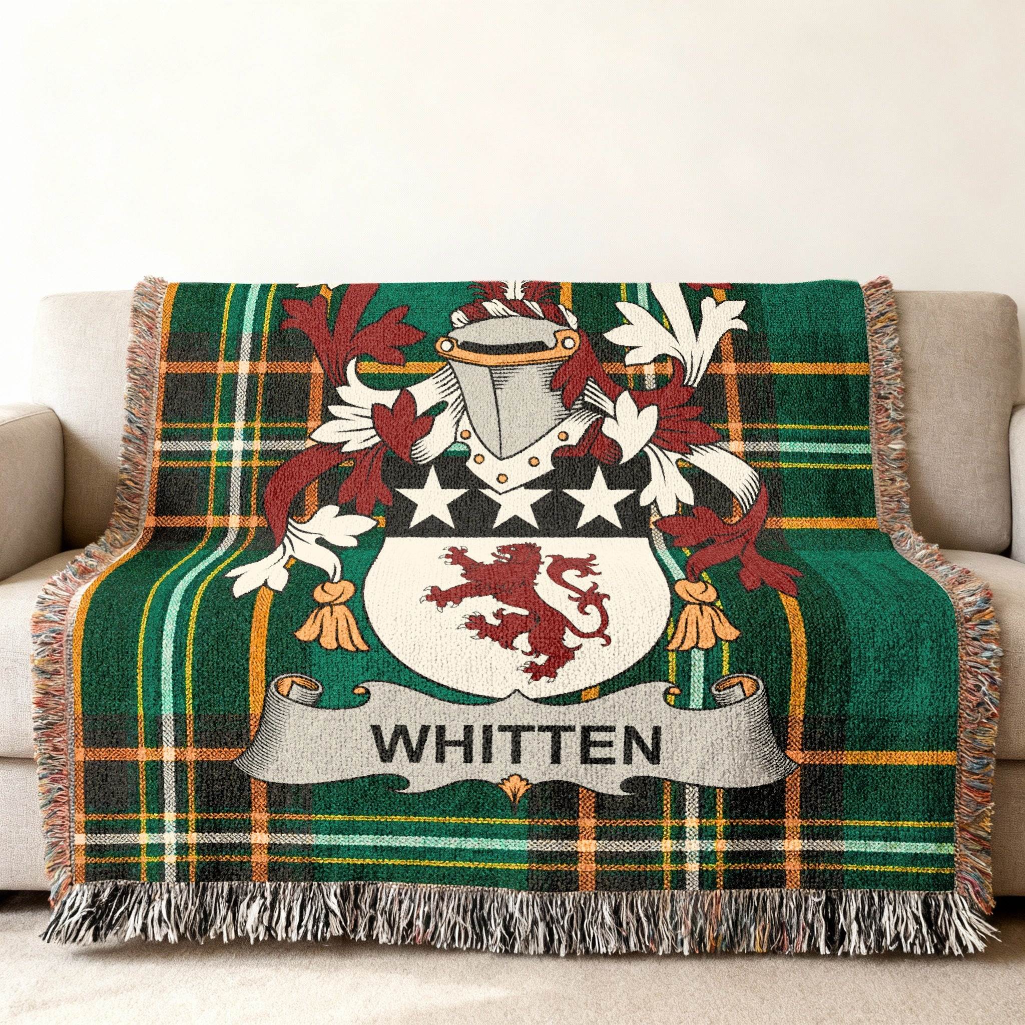 Green plaid throw blanket with Whitten family crest.