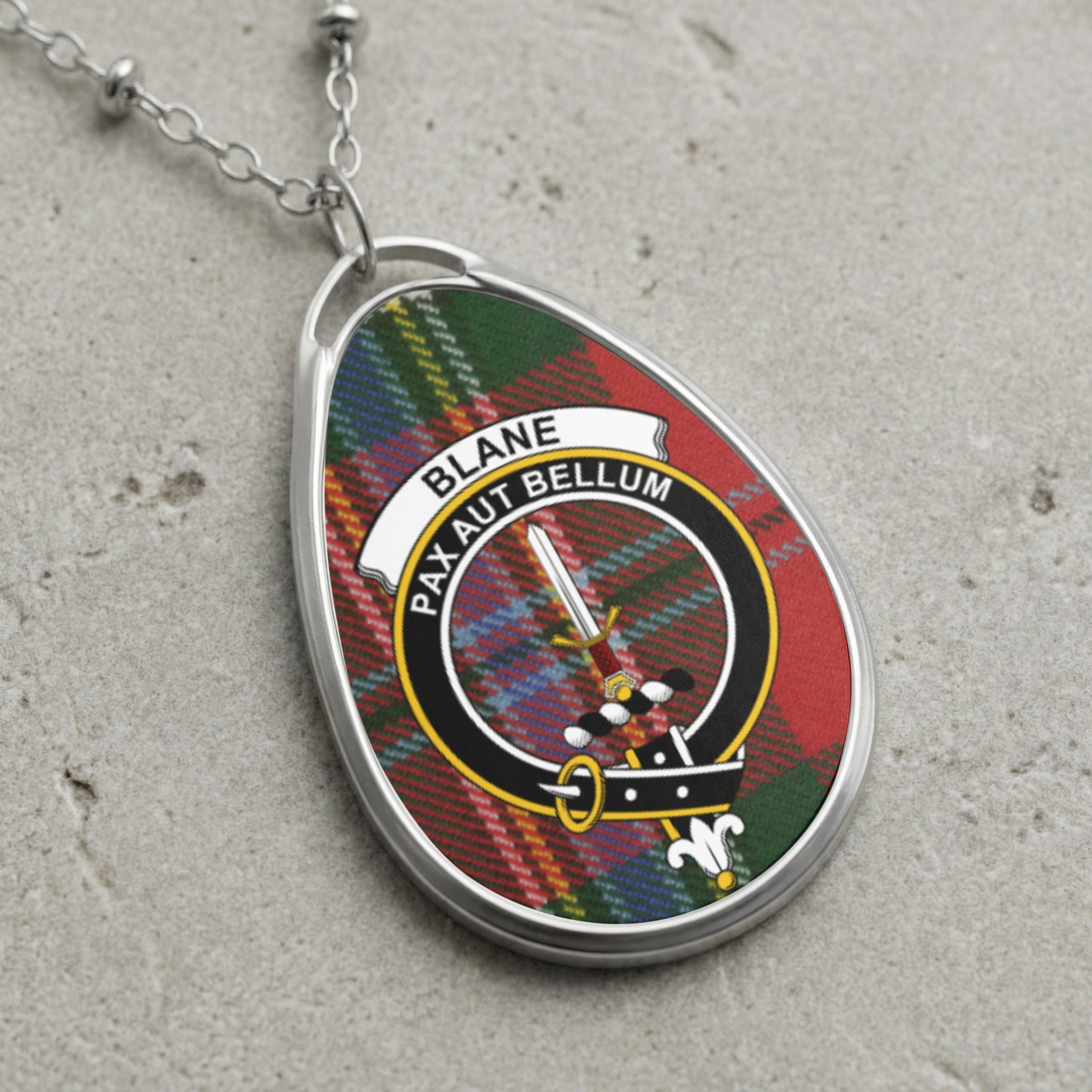 Blane clan Scottish tartan necklace with clan crest and Pax Aut Bellum motto on tartan background