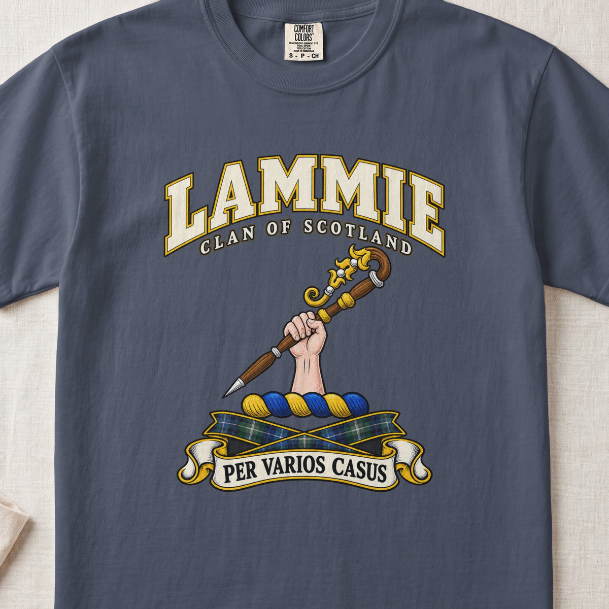 Lammie Scottish clan T-shirt in Midnight, front view with a hand holding an ornate crozier and motto design.