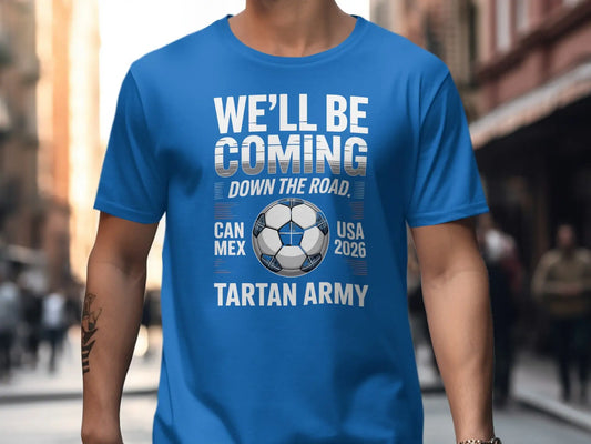 Blue t-shirt with "WE'LL BE COMING DOWN THE ROAD" and "TARTAN ARMY" text.