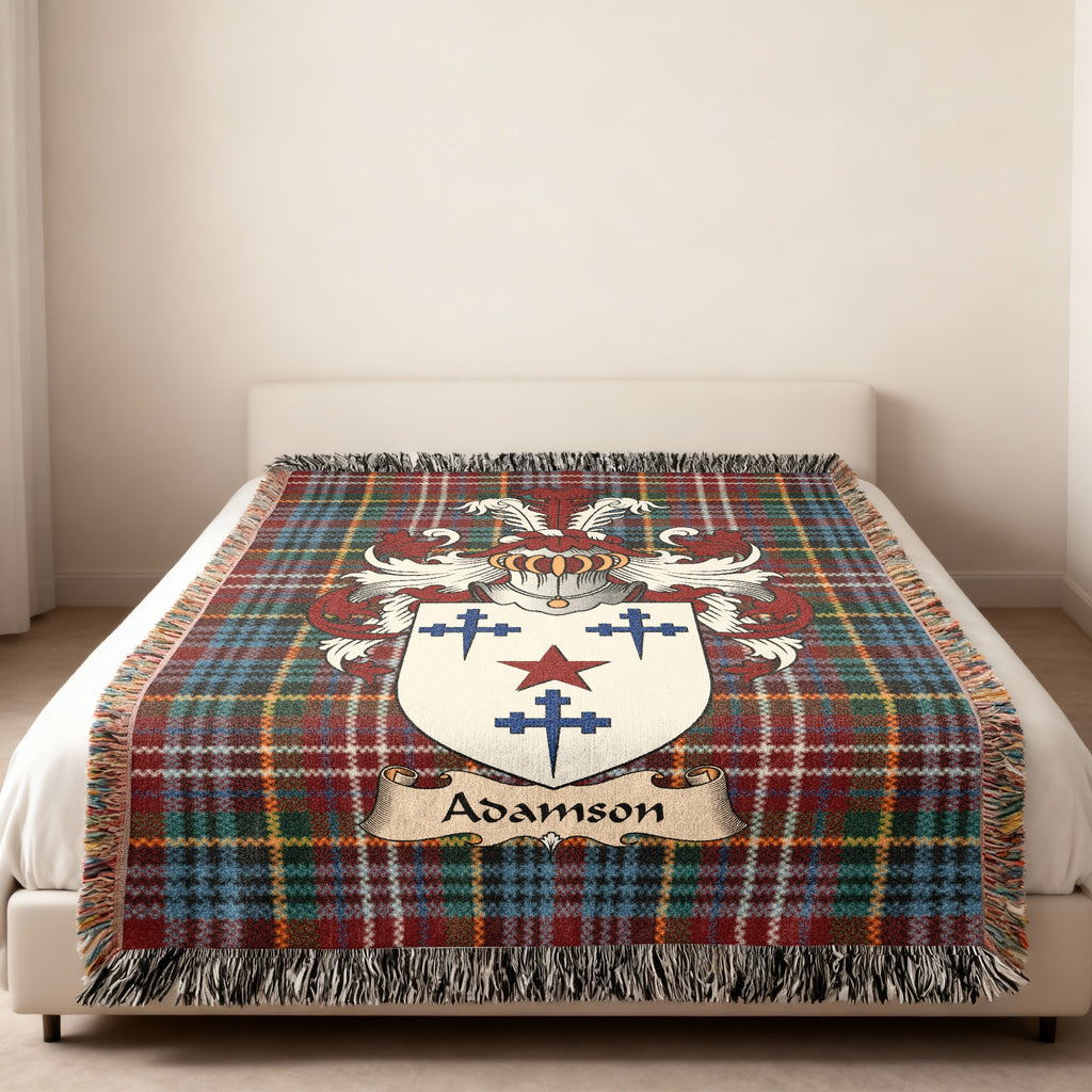 Adamson family crest emblem on a Caledonia tartan woven blanket