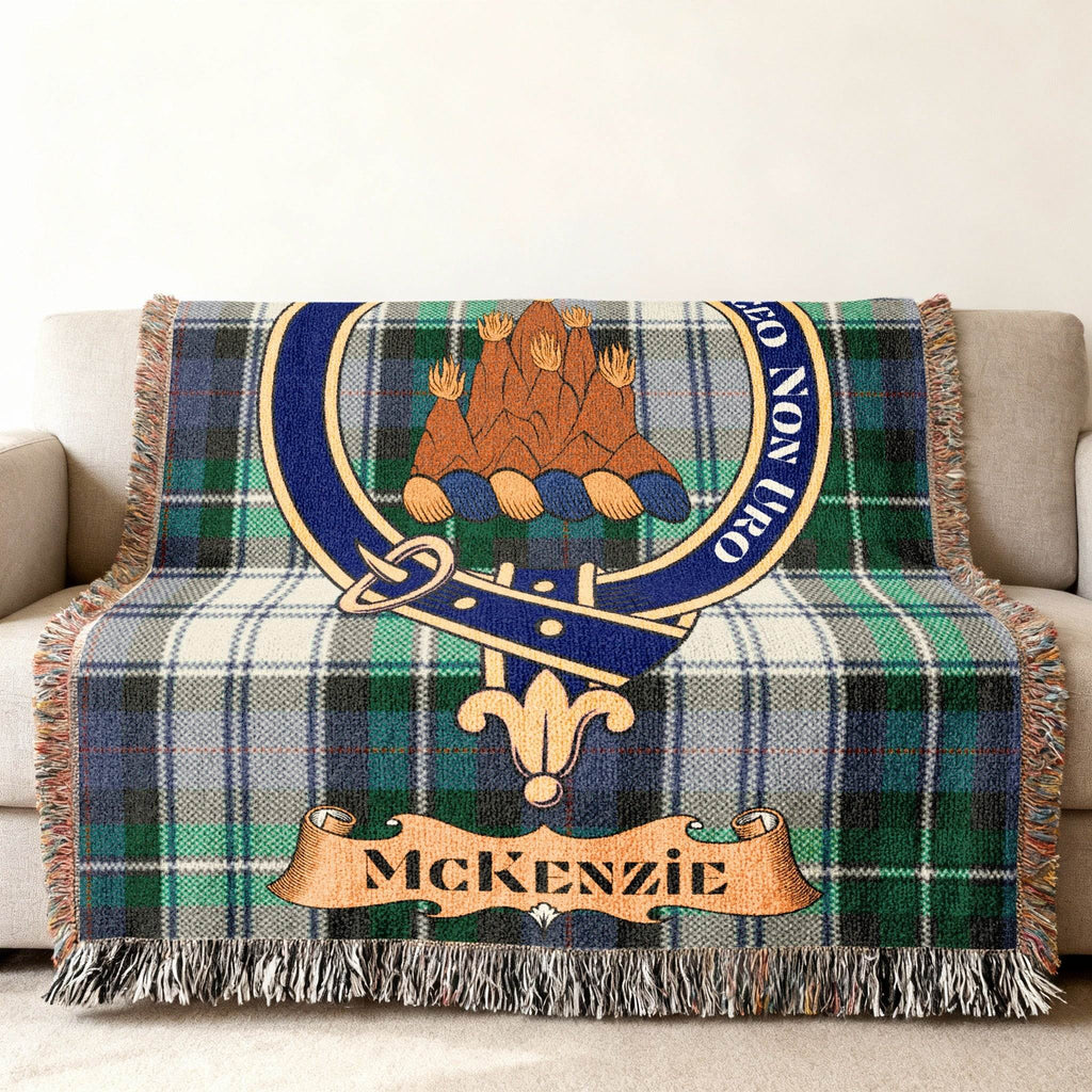MacKenzie clan crest and tartan design woven blanket — fringe edge visible, 100% cotton