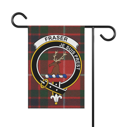 Fraser tartan flag with motto "Je Suis Prest" on a garden stake.