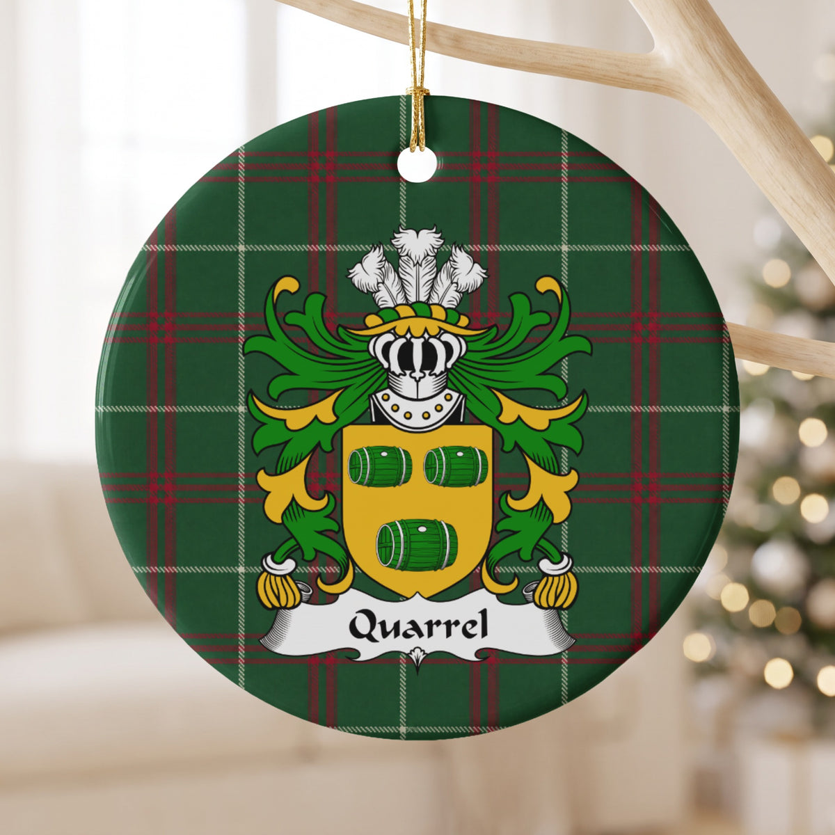 Quarrel round Welsh National Tartan ornament hanging from a pale wooden branch, featuring three green barrels on a gold shield.