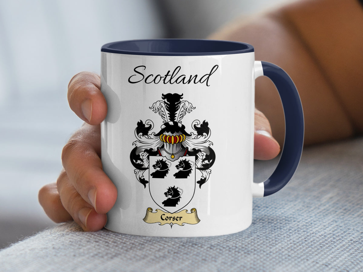 White Corser heritage mug with navy handle and interior, displaying “Scotland” and the colourful family emblem.