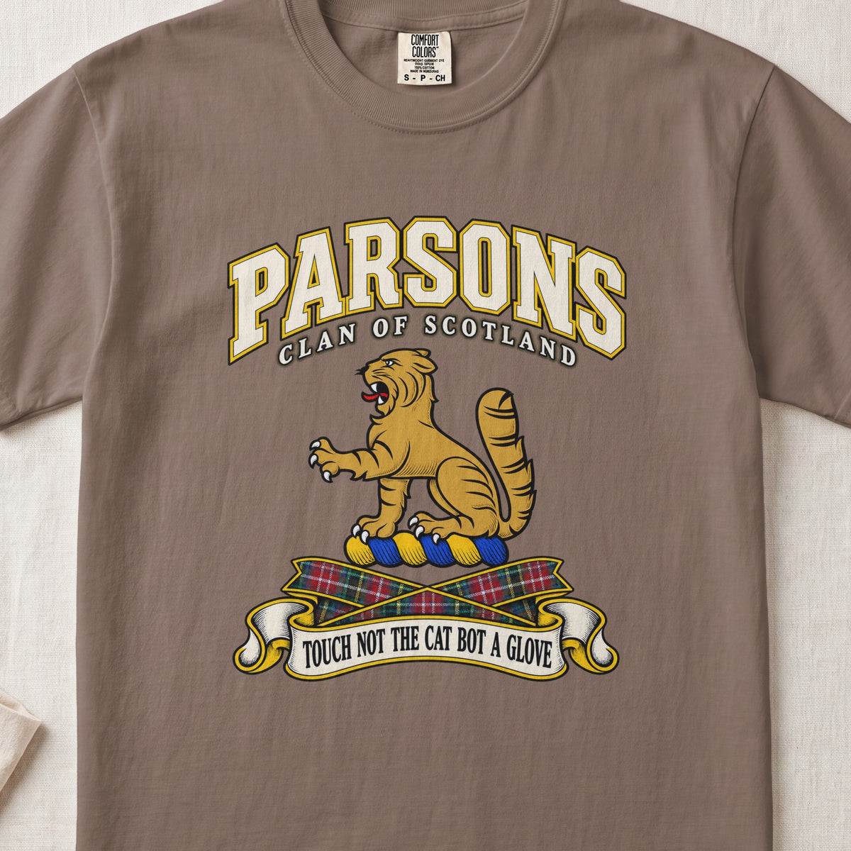 Parsons Scottish clan T-shirt in Espresso, front view with a golden wildcat and motto design.