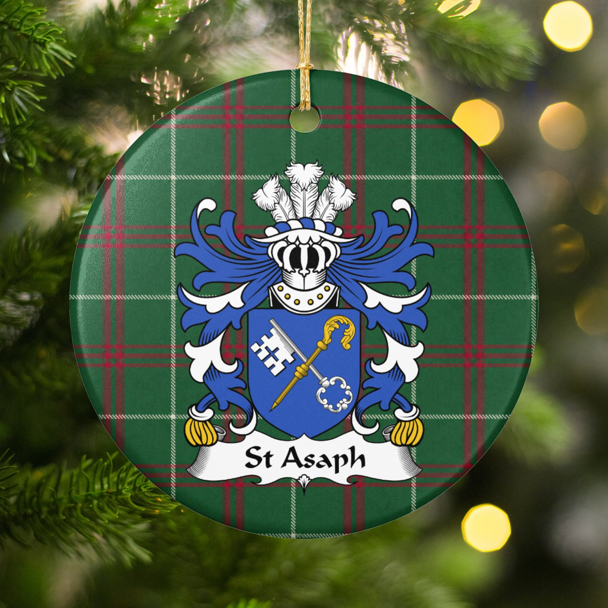 St Asaph ornament hanging on a Christmas tree, with blue shield with a crossed white key and gold crozier on Welsh National Tartan.