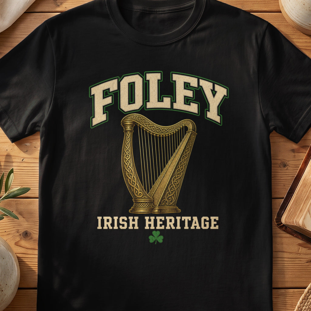 Foley Irish harp T-shirt in Black, with cream surname lettering, a gold-toned harp, green shamrock and “Irish Heritage” text.