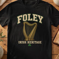 Foley Irish harp T-shirt in Black, with cream surname lettering, a gold-toned harp, green shamrock and “Irish Heritage” text.
