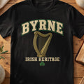 Byrne Irish harp T-shirt in Black, with cream surname lettering, a gold-toned harp, green shamrock and “Irish Heritage” text.